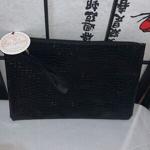 Zipper Black clutch/ wristlet  style purse in faux patent leather.